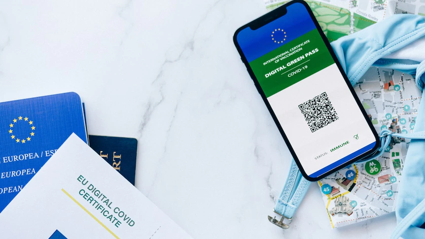 An EU passport and digital green pass for COVID-19 on a smart phone.