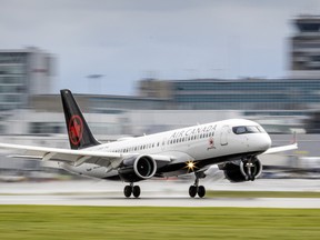 An Air Canada jet lands at Montréal-Pierre Elliott Trudeau International Airport in Dorval, June 9, 2022.