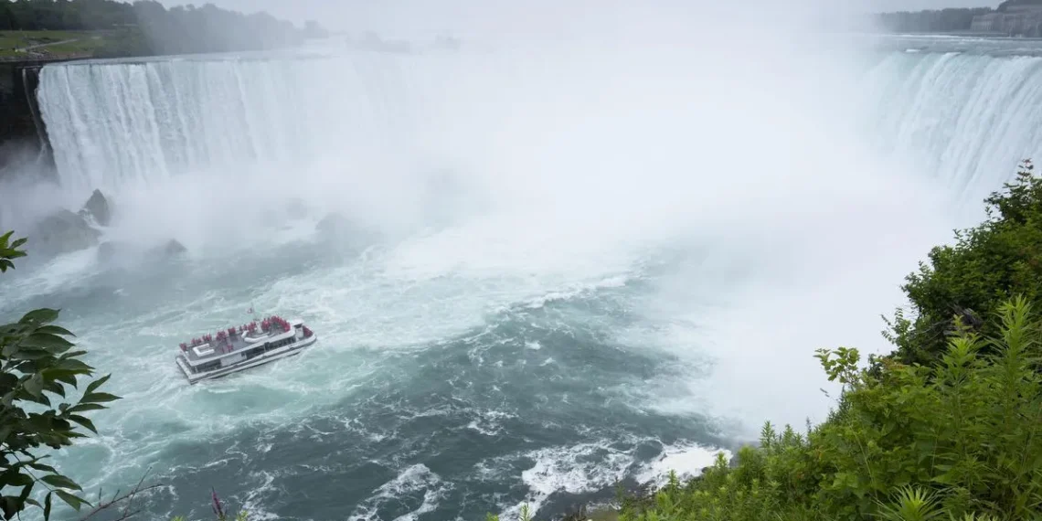 A Niagara tour boat to the falls with less-than-capacity onboard approaches the Horseshoe Falls in Niagara Falls, Ont. last year. Tourism is starting to recover but still far below pre-pandemic levels.