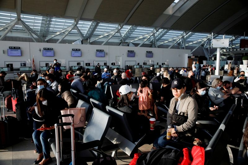 FILE PHOTO: Travellers crowd the departures lounge at Toronto Pearson International Airport in Mississauga