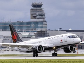 An Air Canada Airbus A220-300 jet lands at Montréal-Pierre Elliott Trudeau International Airport in Dorval.