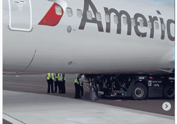 Tug and driver get stuck underneath American Airlines Boeing 737 800 - Travel News, Insights & Resources.