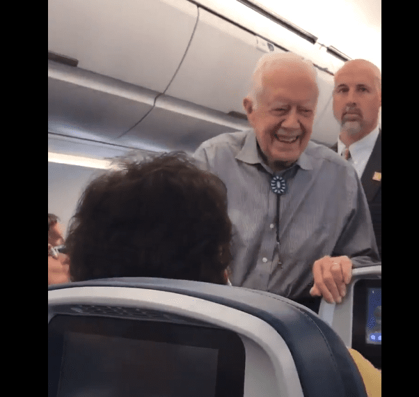 Former President Carter Walking Through Coach Greeting Passengers On Delta - Travel News, Insights & Resources.
