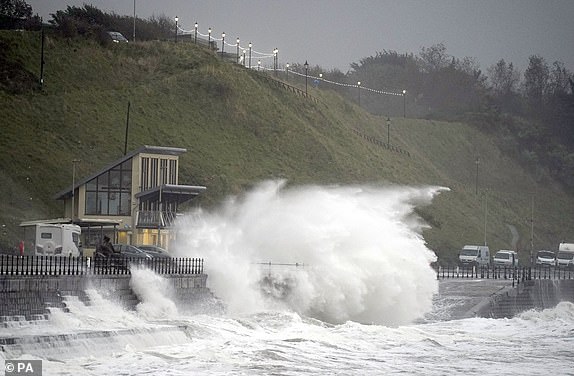 Waves crash over the promenade in Scarborough, as Storm Babet batters the country. Flood warnings are in place in Scotland, as well as parts of northern England and the Midlands. Thousands were left without power and facing flooding from "unprecedented" amounts of rain in east Scotland, while Babet is set to spread into northern and eastern England on Friday. Picture date: Friday October 20, 2023. PA Photo. See PA story WEATHER Babet. Photo credit should read: Danny Lawson/PA Wire
