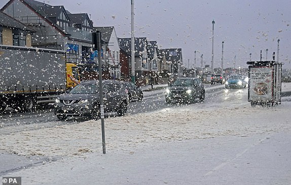 Sea foam covers a road in Seaburn, Sunderland,  as Storm Babet batters the country. Flood warnings are in place in Scotland, as well as parts of northern England and the Midlands. Thousands were left without power and facing flooding from "unprecedented" amounts of rain in east Scotland, while Babet is set to spread into northern and eastern England on Friday. Picture date: Friday October 20, 2023. PA Photo. See PA story WEATHER Babet. Photo credit should read: Owen Humphreys/PA Wire