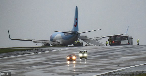 Emergency services at the scene after a passenger plane came off the runway at Leeds Bradford Airport while landing in windy conditions during Storm Babet. Picture date: Friday October 20, 2023. PA Photo. See PA story WEATHER Babet. Photo credit should read: Danny Lawson/PA Wire