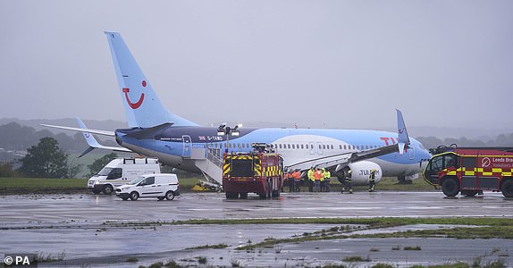 Emergency services at the scene after a passenger plane came off the runway at Leeds Bradford Airport while landing in windy conditions during Storm Babet. Picture date: Friday October 20, 2023. PA Photo. Flood warnings are in place in Scotland, as well as parts of northern England and the Midlands. Thousands were left without power and facing flooding from "unprecedented" amounts of rain in east Scotland, while Babet is set to spread into northern and eastern England on Friday.  See PA story WEATHER Babet. Photo credit should read: Danny Lawson/PA Wire