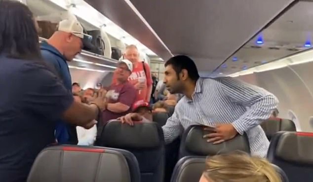 Video of the incident has since gone viral online and was posted into three parts. (pictured: the moment the other passenger decided to control the unruly man)