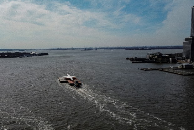 A retired British Airways Concorde supersonic aircraft is transported by barge on the East River, Wednesday, March 13, 2024, in New York. (AP Photo/Peter K. Afriyie)