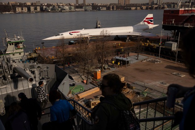 A retired British Airways Concorde supersonic aircraft is transported by barge on the Hudson River to the Intrepid Museum, Thursday, March 14, 2024, in New York. (AP Photo/Yuki Iwamura)