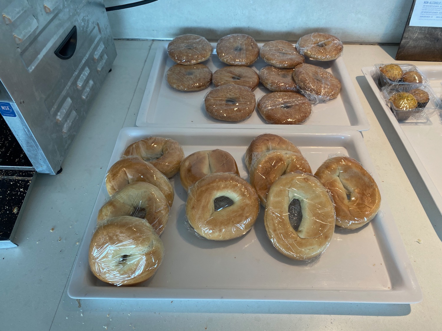 a trays of bagels wrapped in plastic
