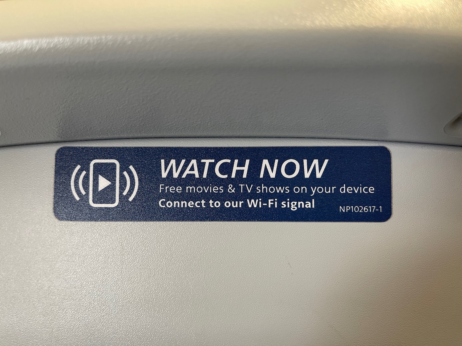 a blue and white sticker with white text