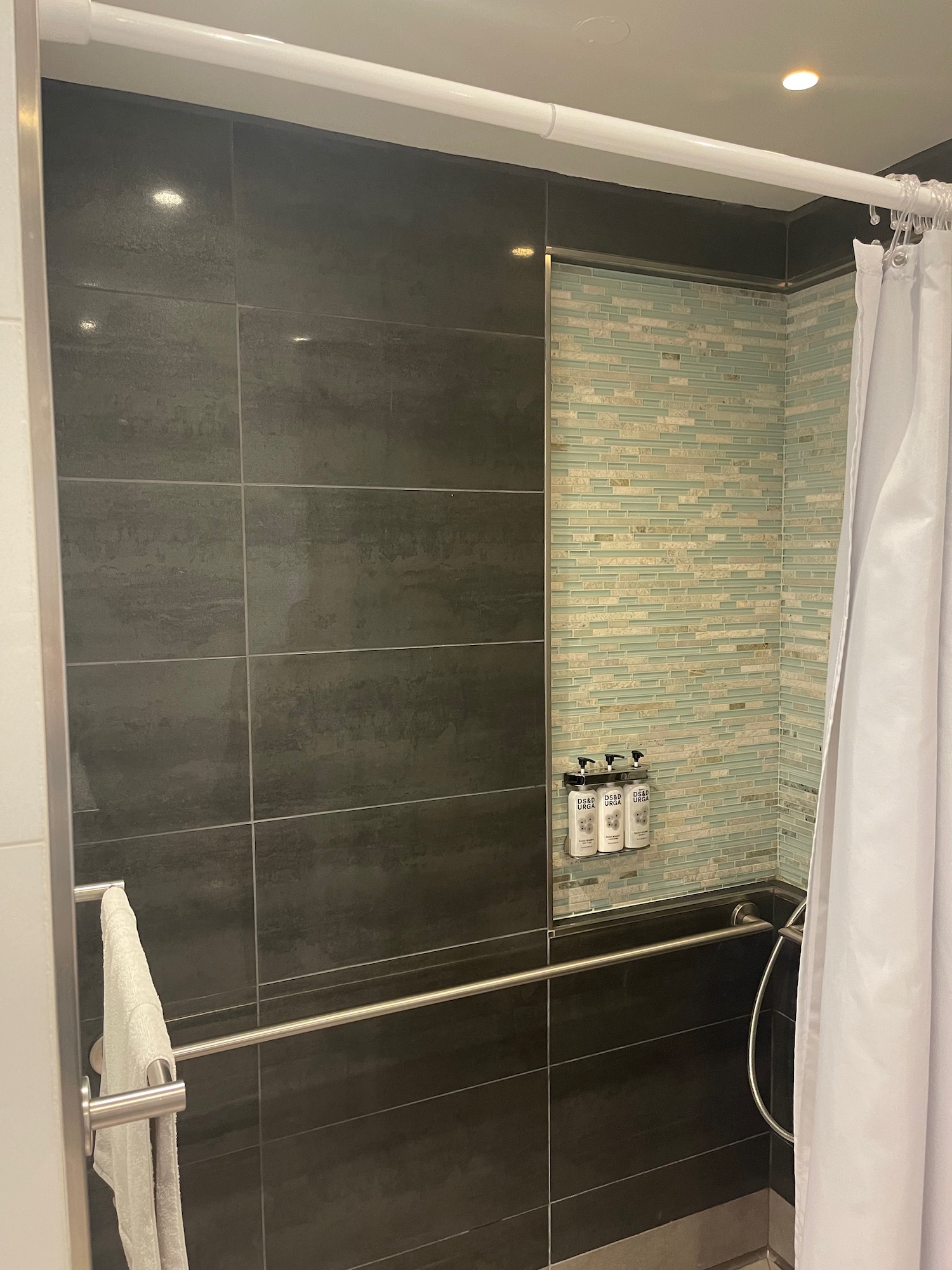 a shower with a shower curtain