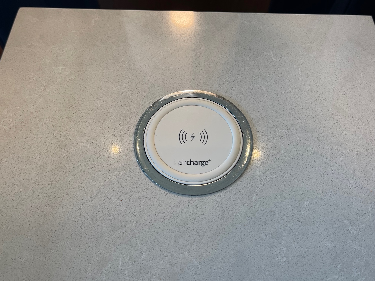 a white wireless charger on a white surface