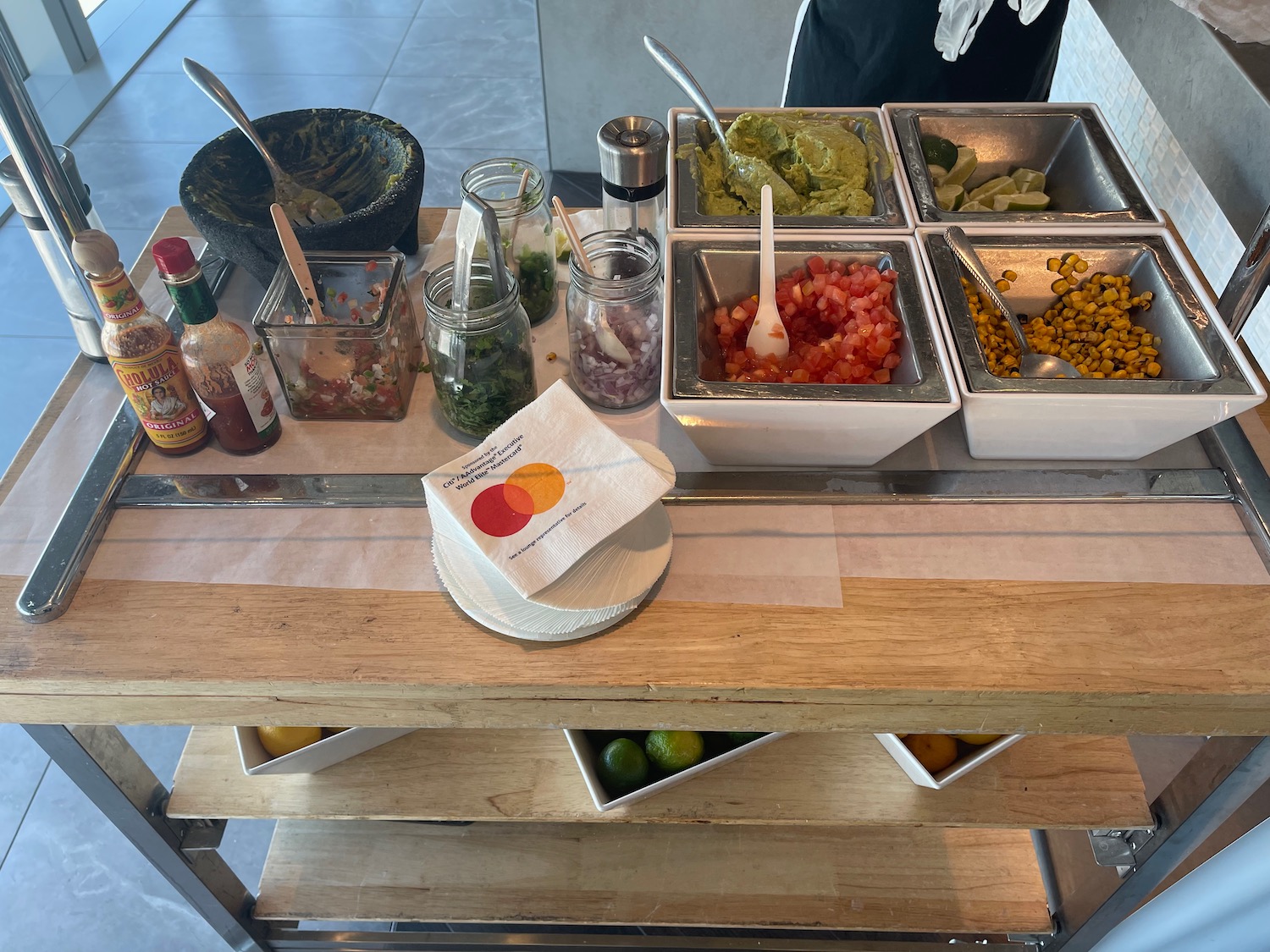 a table with bowls of food and sauces