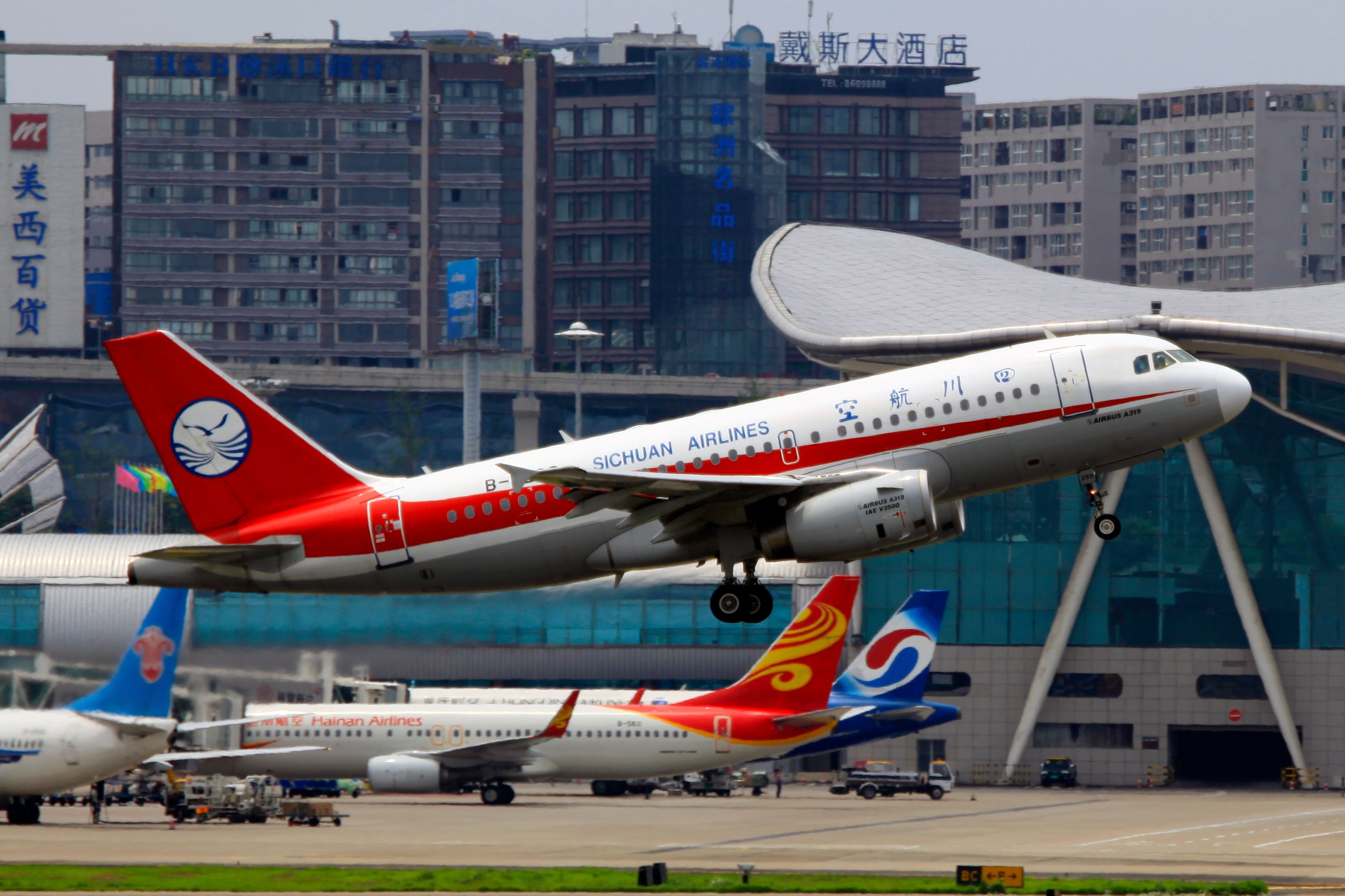 A Sichuan Airlines Airbus A319-133 taking off from Chongqing Jiangbei International Airport.