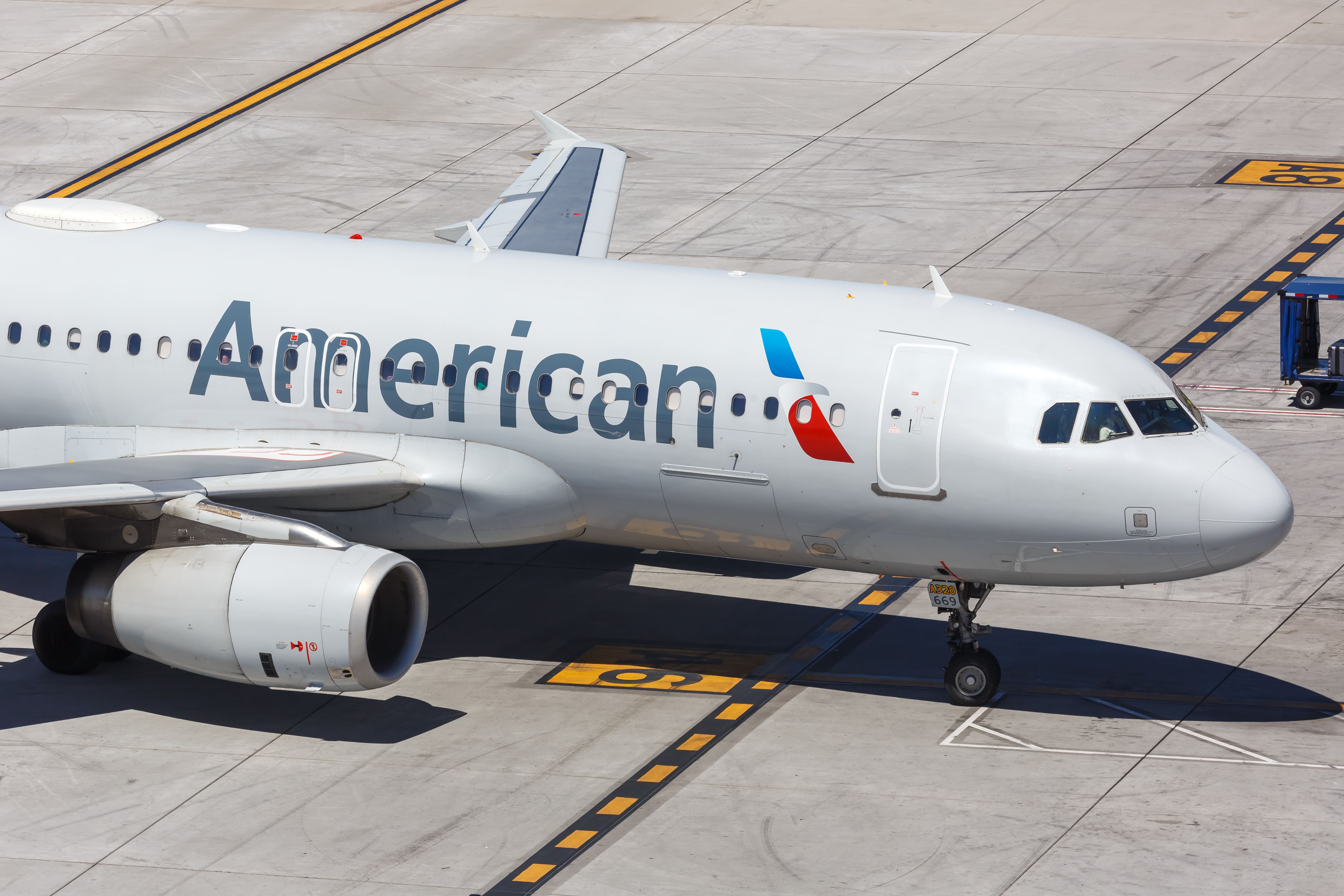 An American Airlines Airbus A320 on an airport apron.