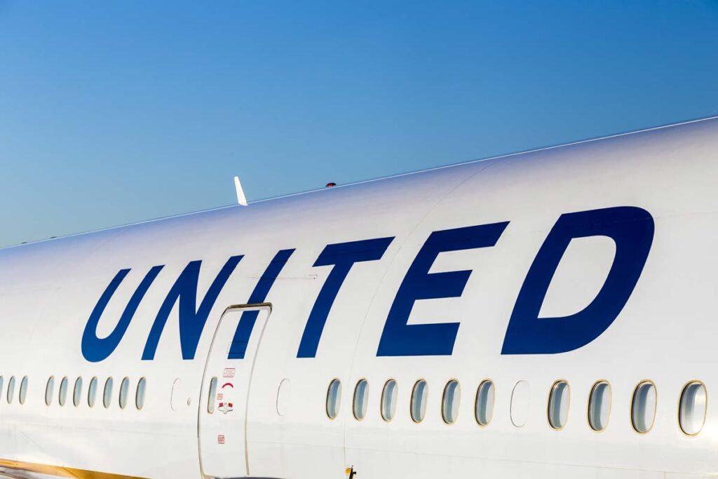 Close up of United logo on the side of an airplane, representing the United Airlines class action.