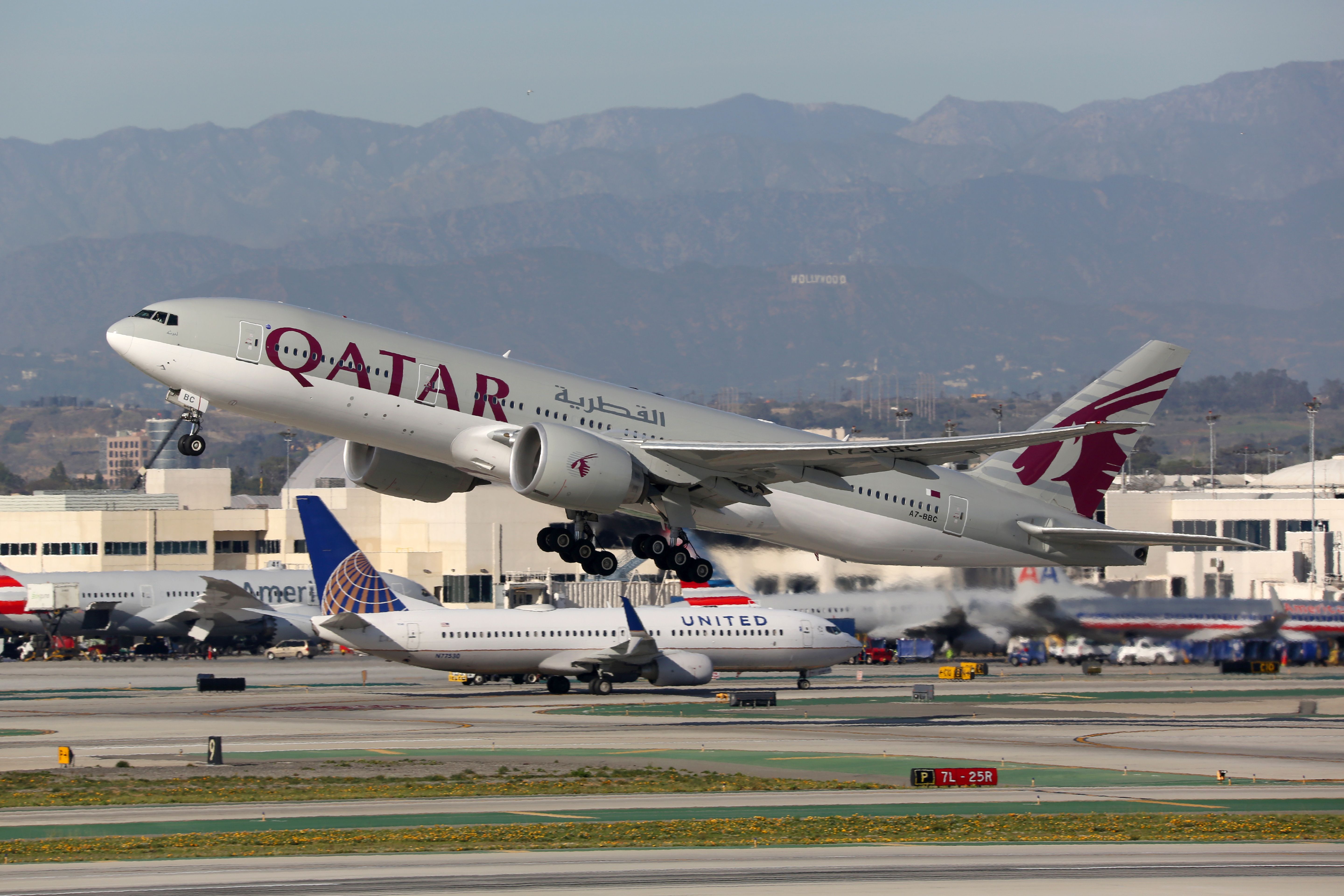 A Qatar Airways Boeing 777-200LR taking off.