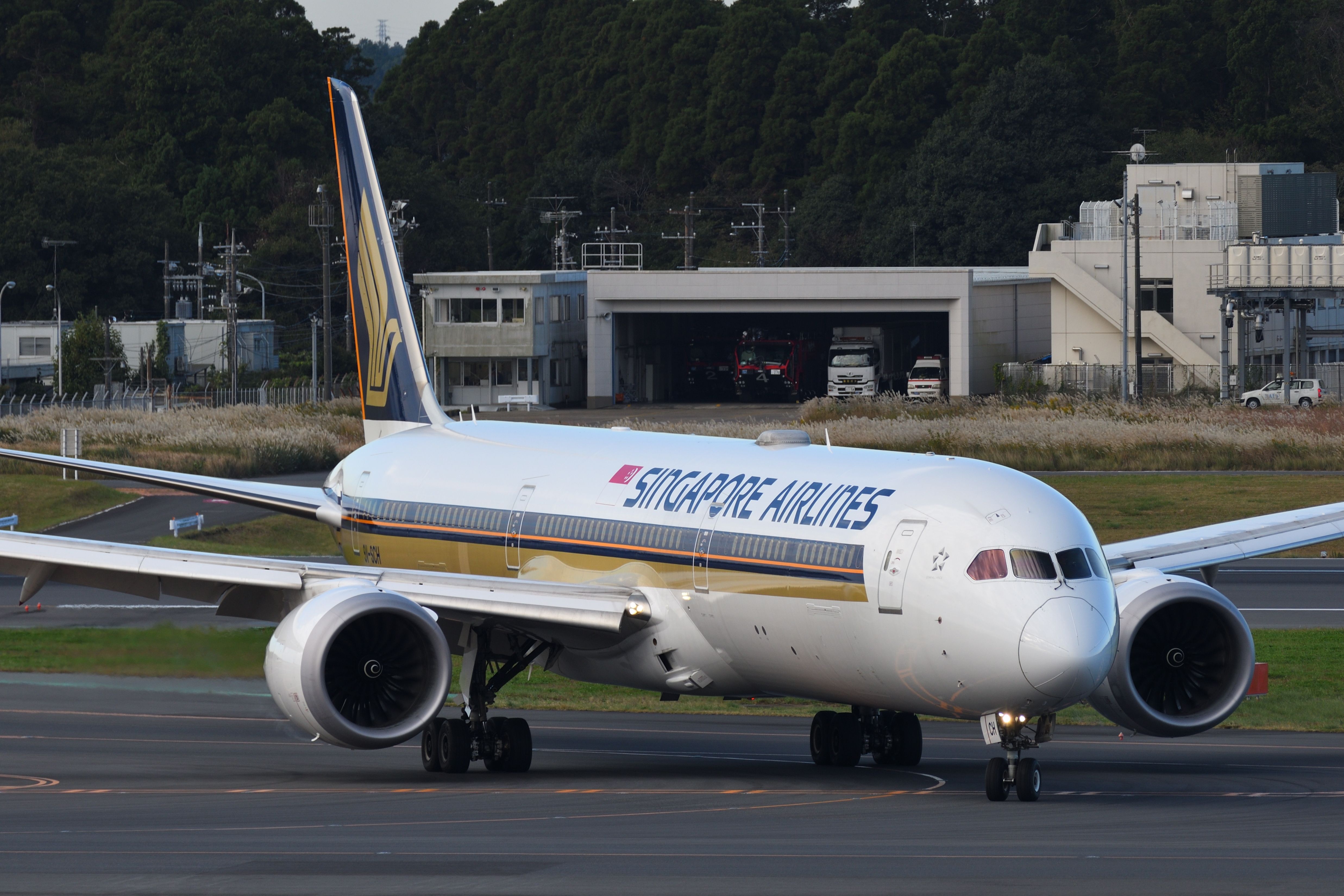 A Singapore Airlines Boeing 787-10 on an airport apron.