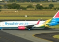 FlySafair Boeing 737 800 Loses Main Landing Gear Wheel On Take Off scaled - Travel News, Insights & Resources.