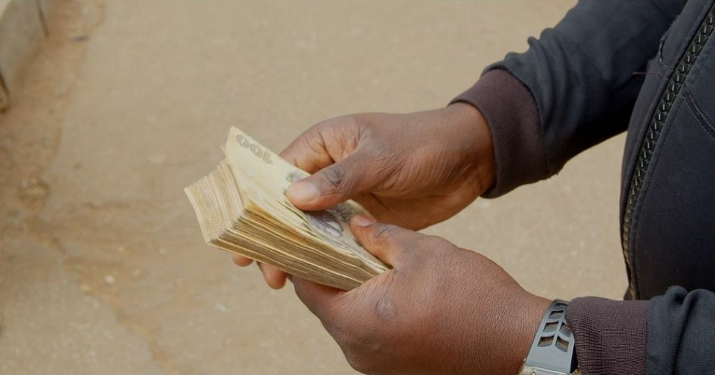 Zimbabweans forced to use US dollar in absence of new - Travel News, Insights & Resources.